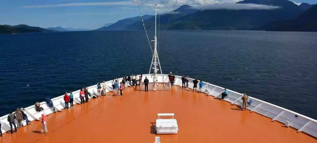 Seniors relax and take in the stunning Alaskan views from the ship’s deck, where every moment is a memory in the making.